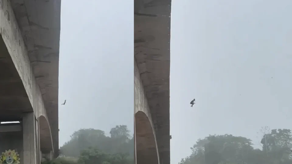 Jovem é flagrado pulando de ponte durante temporal; Veja o vídeo