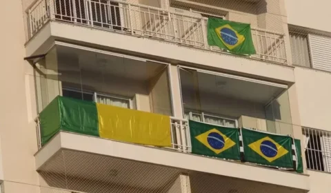 Condomínios no ES entram em polêmica após ameaça de multa por bandeiras do Brasil em varanda