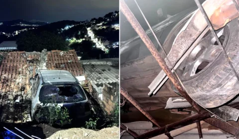 Carro bate em muro e fica pendurado sobre telhado de casa na Grande BH