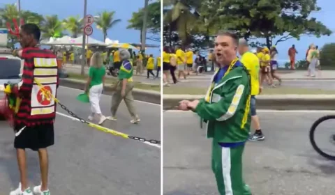 Homem negro aparece acorrentado durante ato de apoio a Flávio Bolsonaro no Rio